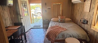 Cozy cabin features features queen pullout and twin in loft.  Pet friendly