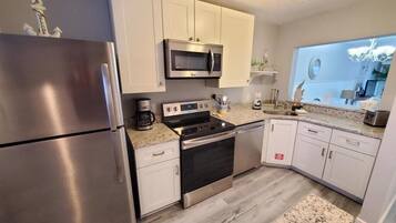 Condo, Multiple Beds, Balcony, Ocean View | Private kitchen | Fridge, microwave, oven, stovetop