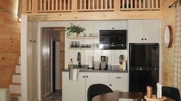 Fridge, microwave, coffee/tea maker, cookware/dishes/utensils