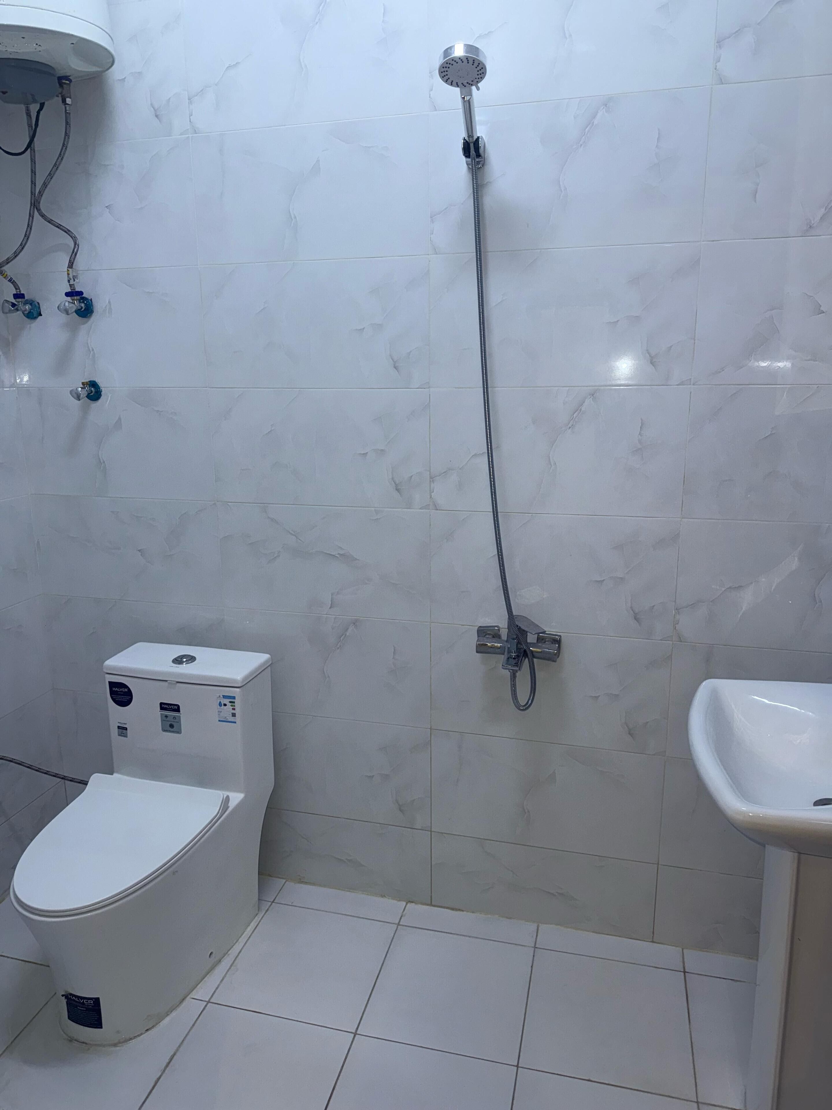 Separate bathtub and shower, hair dryer, soap, shampoo
