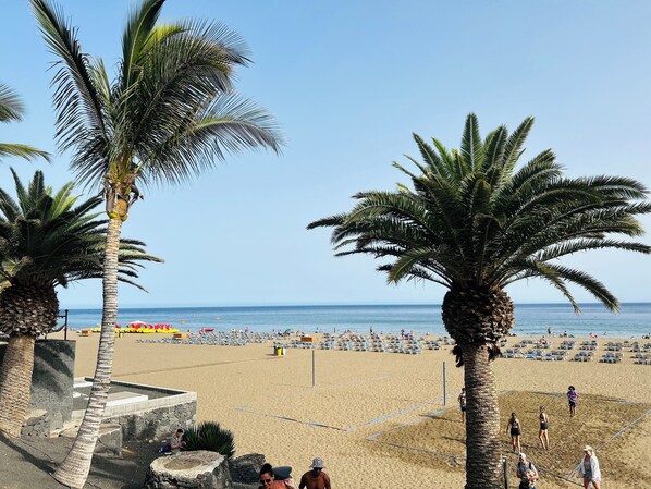 On the beach, sun loungers, beach towels