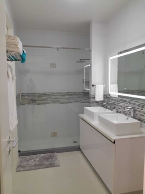 Shower, hair dryer, towels, soap