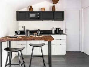 Fridge, microwave, stovetop, coffee/tea maker