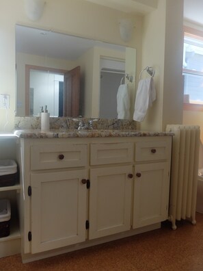 Shower, hair dryer, towels, toilet paper