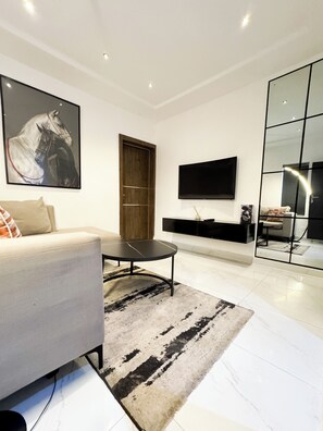 Premier Apartment | Living area | Smart TV, streaming services - LUXE APARTMENTS (Lagos)