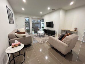 Apartamento ejecutivo | 2 dormitorios, cortinas opacas, tabla de planchar con plancha