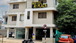 A multi-story building with a sign reading "HOTEL A1 PLAZA". - Hotel A1 Plaza - Ahmedabad (Ahmedabad)