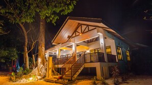 A two-story building with a wooden staircase and a balcony. - El Nido Water Front (El Nido)