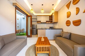 Villa, Pool View | Living area | 32-inch LCD TV with digital channels - Cove Ume Nerus Residences & Villa (Canggu)