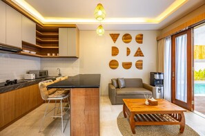 Villa, Pool View | Living area | 32-inch LCD TV with digital channels - Cove Ume Nerus Residences & Villa (Canggu)