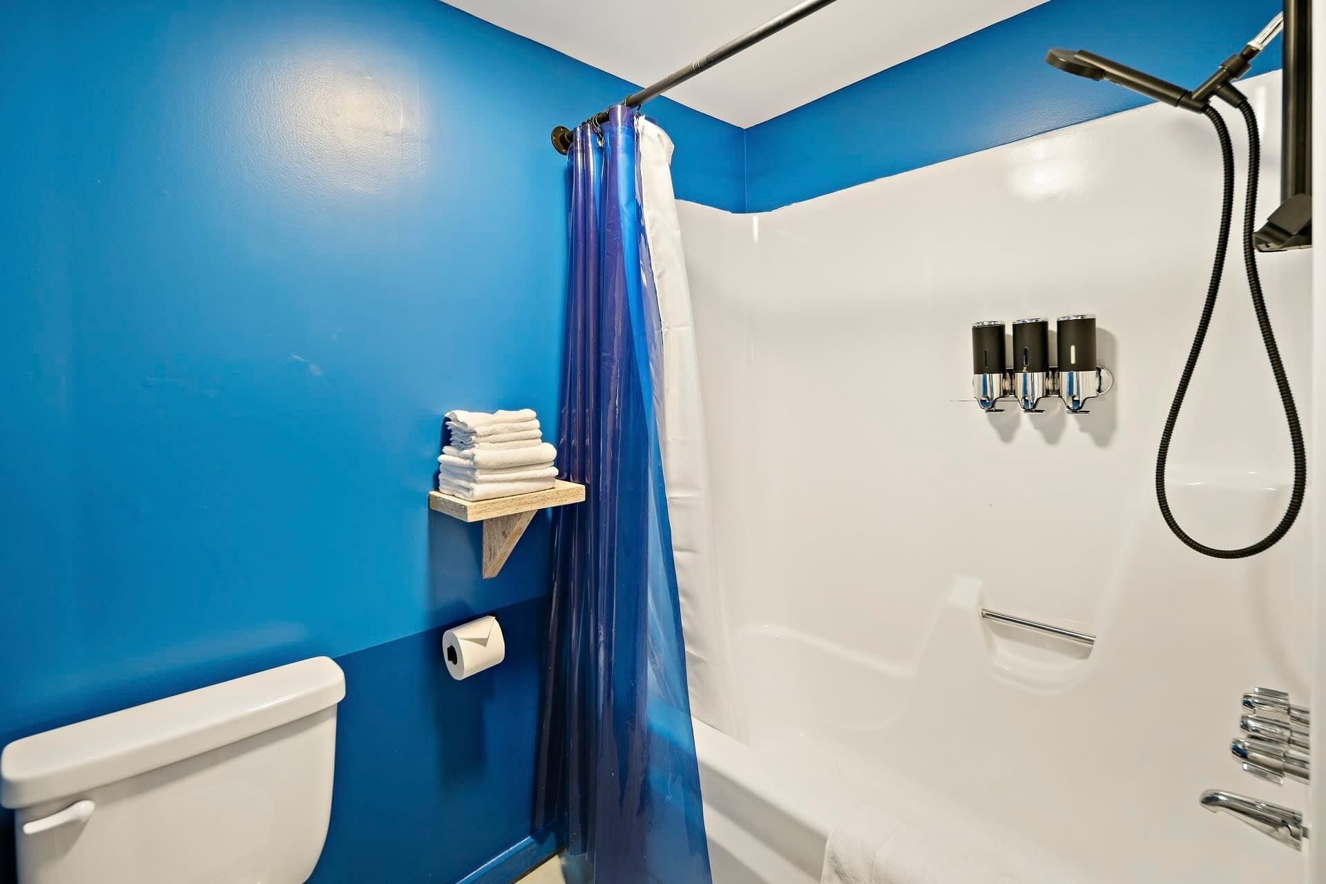 Shower, hair dryer, towels, shampoo