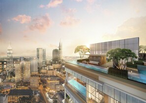Een hoog gebouw met een zwembad op het dak en een modern ontwerp.