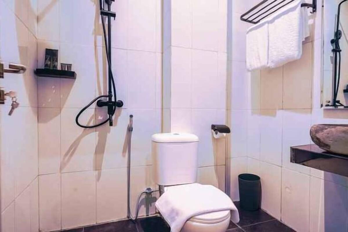 Baño | Regadera y toallas