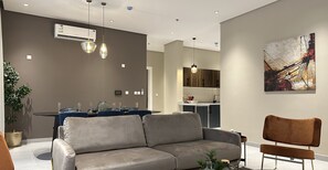 Design Apartment, 3 Bedrooms | Living area | Flat-screen TV