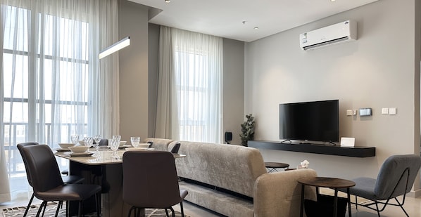 Design Apartment, 3 Bedrooms | Living area | Flat-screen TV