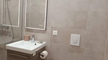 Eco-friendly toiletries, hair dryer, towels