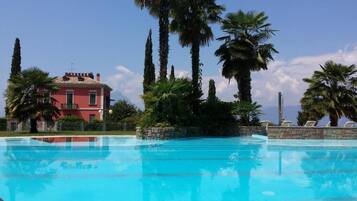 Seasonal outdoor pool, pool umbrellas, sun loungers
