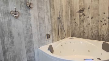 Jetted tub, hair dryer, towels, soap