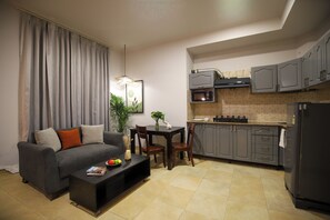 Standard Studio | Living area | LCD TV - BedChambers Serviced Apartments SushantLok (Gurugram)