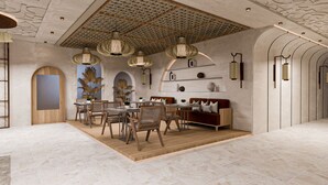 A modern interior with a dining area, seating, and decorative elements. - Renex Hotels (Antalya)