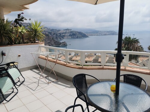 Beautiful holiday ground floor apt with garden, big balcony and shared pool