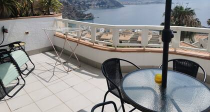 Beautiful holiday ground floor apt with garden, big balcony and shared pool