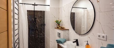 Shower, hair dryer, towels, soap