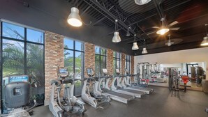 A gym with treadmills, ellipticals, and weight machines.