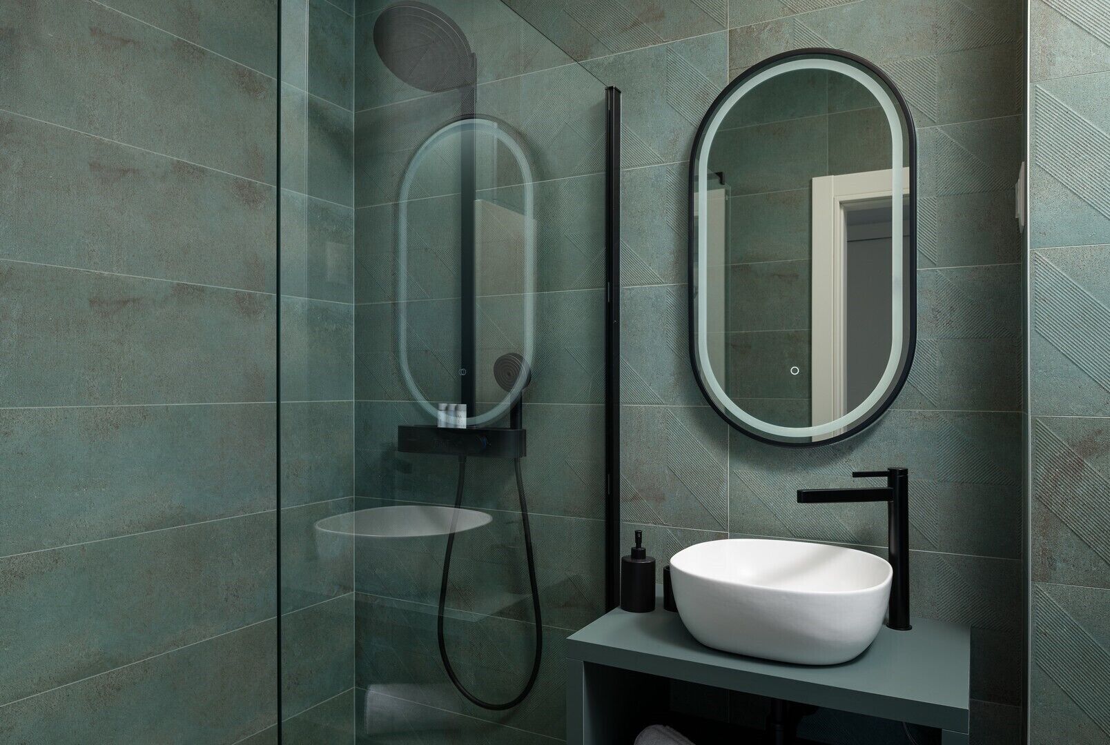 Un baño moderno con ducha acristalada, un espejo redondo y un lavabo blanco.