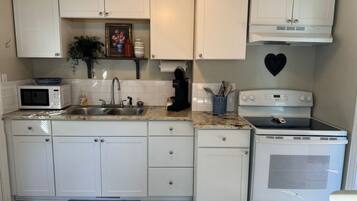 Fridge, microwave, stovetop, coffee/tea maker