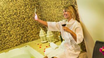 Unwind in a serene bathtub, complete with a glass of wine.