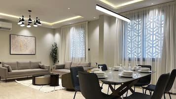 Design Apartment, 3 Bedrooms | Living area | Flat-screen TV