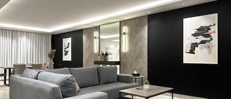 Departamento de diseñador, 3 habitaciones | Área de sala de estar | Televisión de pantalla plana