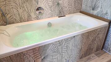 Jetted tub, hair dryer, towels, soap