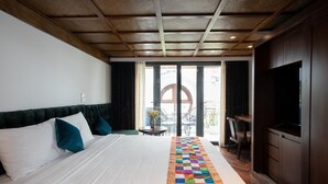 A hotel room with a large bed, a wooden ceiling, a TV, and a view of the outside balcony. - Fusion Links Apartment (Hanoi)
