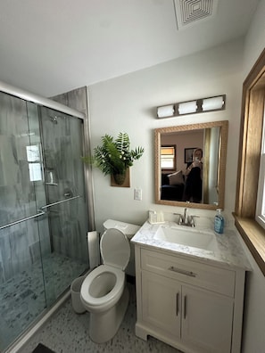 Shower, hair dryer, towels, soap