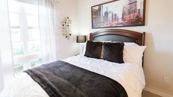 1 bedroom, desk, iron/ironing board, travel crib