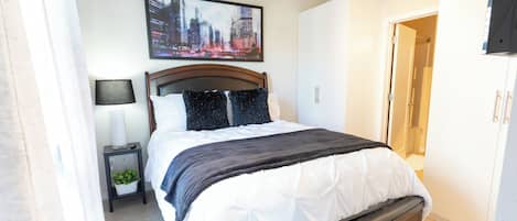 1 bedroom, desk, iron/ironing board, travel crib