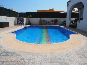 Seasonal outdoor pool, open 9:00 AM to 11:00 PM, pool umbrellas