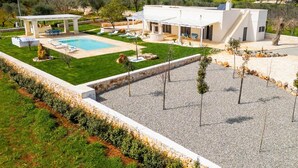 A modern villa with a swimming pool, outdoor seating, and a well-maintained garden. - Villa Angelita by Villa Plus (Ceglie Messapica)