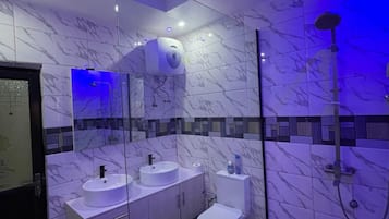 Shower, towels, soap, toilet paper