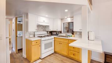 Fridge, microwave, stovetop, coffee/tea maker