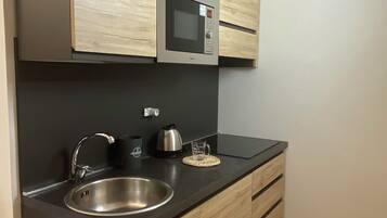 Fridge, microwave, stovetop, coffee/tea maker