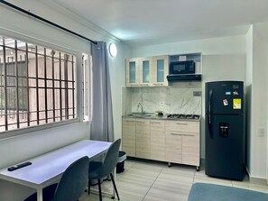 Apartment | Private kitchen | Mini-fridge, microwave, cookware/dishes/utensils