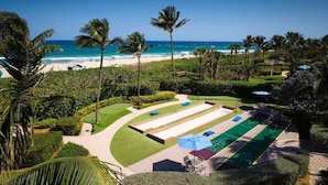 A golf course with a view of the beach and ocean. - Singer Island | Coastal Escape | Pools & Beach Days (Palm Beach Shores)