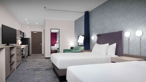 A hotel room with two beds, a desk with a TV, and a mirror. - Home2 Suites By Hilton Athens I 65 (Athens)