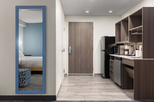 Desk, laptop workspace, blackout drapes, iron/ironing board