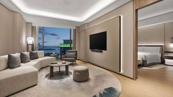 Deluxe Suite, 1 King Bed | Living area | 55-inch LED TV with satellite channels