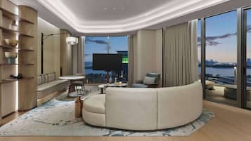 Premium Suite, 1 King Bed | Living area | 55-inch LED TV with satellite channels