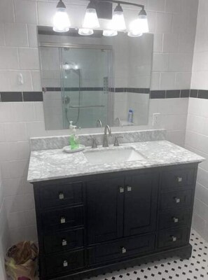 Shower, hair dryer, towels, soap